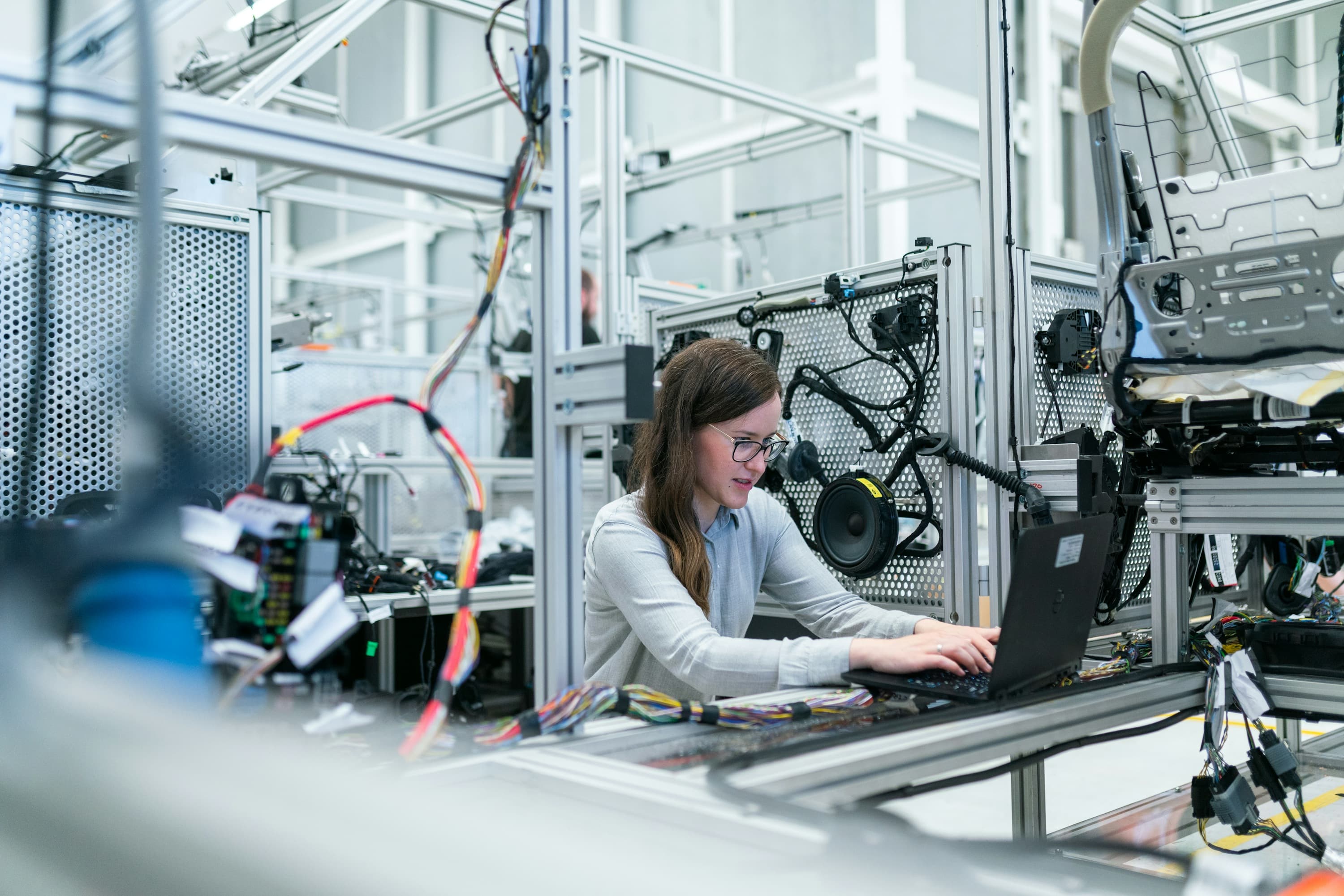 Engineer working with drive electronics on a production line